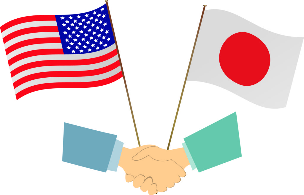 日本と米国相互の国旗と互いに握手しているイラスト
